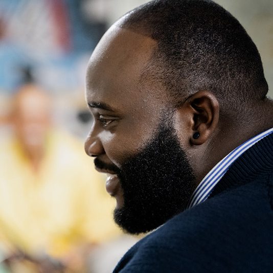 side profile of man smiling